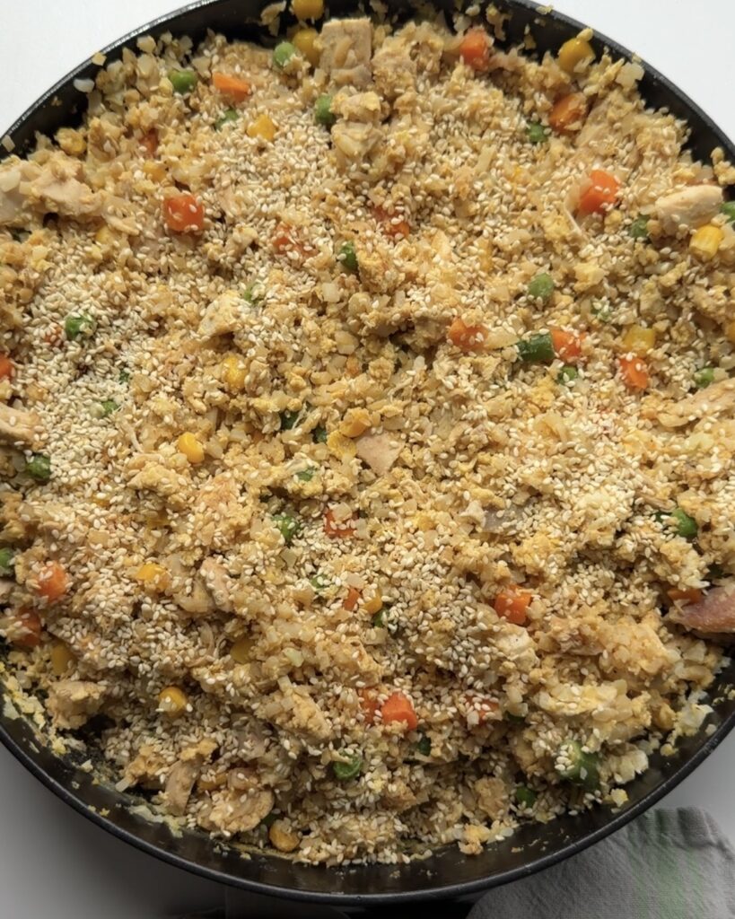 Cauliflower rice mixed with diced vegetables.